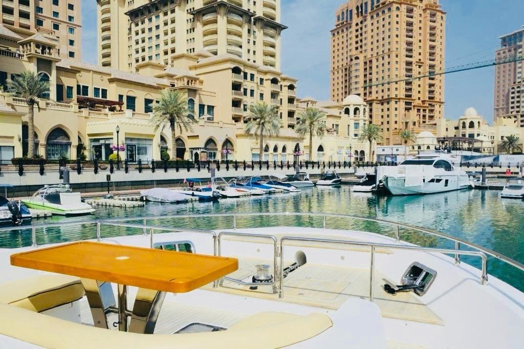 Catamaran anchored on turquoise water — boat day in the Gulf